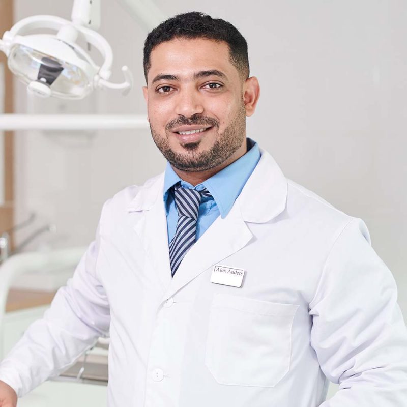 middle-eastern-dentist-posing-by-chair-3WJ4MEV-800x800
