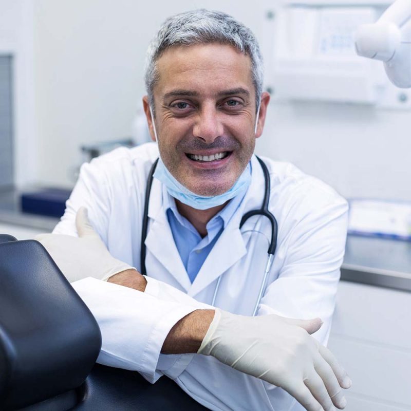 portrait-of-a-smiling-dentist-ALK7GVH-800x800